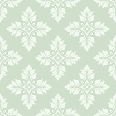 Seamless damask floral pattern on green background.