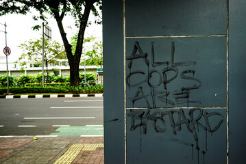 Anti-Police Graffiti on Concrete Wall – Social Unrest Symbol. Editorial Use Only