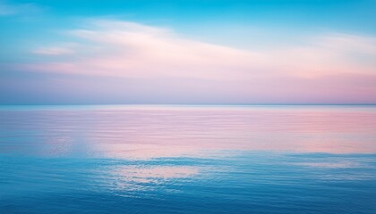 Fototapeta premium pastel sky and calm water with soft reflections pink and blue gradient horizon tranquil seascape scenery for adobe stock photo