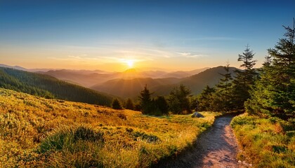 scenic sunrise over rolling mountains and forest landscape with tranquil hiking path
