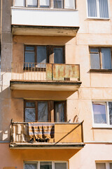 balconies of a multi-storey apartment building are beige. historical architecture, retro balconies. the tourist area.