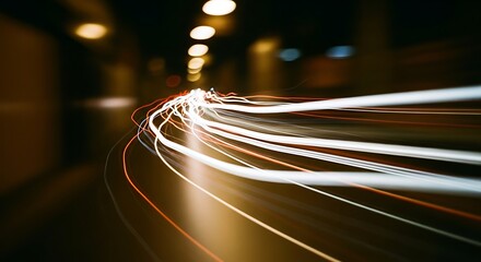 Night traffic motion blur creating vibrant light streaks from cars in a tunnel, symbolizing speed and the flow of urban life.