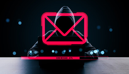 Anonymous hacker in hoodie using laptop with glowing email icon and digital message progress bar on dark background, symbolizing cyber communication.