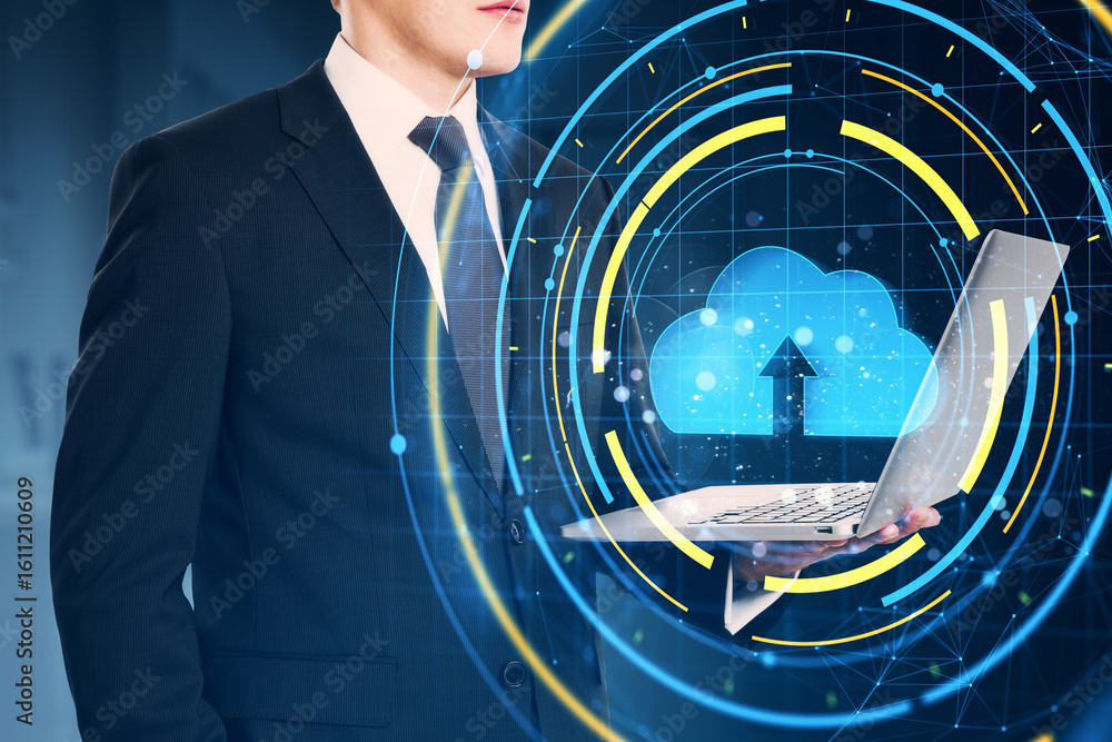 Aufkleber businessman holding laptop with cloud upload icon and digital interface overlay on blue background, 