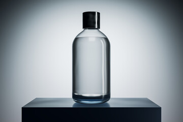 Transparent glass bottle mockup with black cap on podium in spotlight, blank label template for...