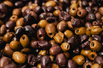 Fresh olives at small local urban market. Organic produce on sale at outdoor farmer market. Selling...