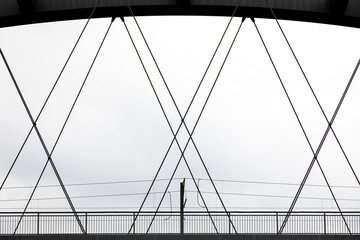 Obraz premium Modern pedestrian bridge arching over white background