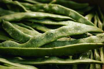 Fresh string beans at small local urban market. Organic produce on sale at outdoor farmer market....