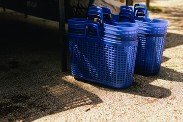Close up of shopping baskets for vegetables on the local Farmers market. Close up.