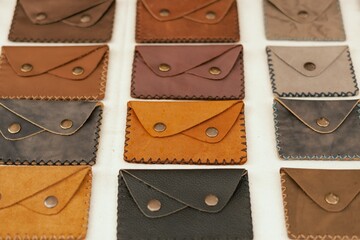 Leather purses on flea market in Lisbon. Garage sale, reuse the clothes, second hand and eco...