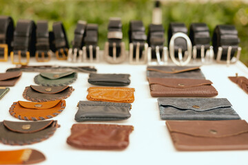 Leather purses on flea market in Lisbon. Garage sale, reuse the clothes, second hand and eco...