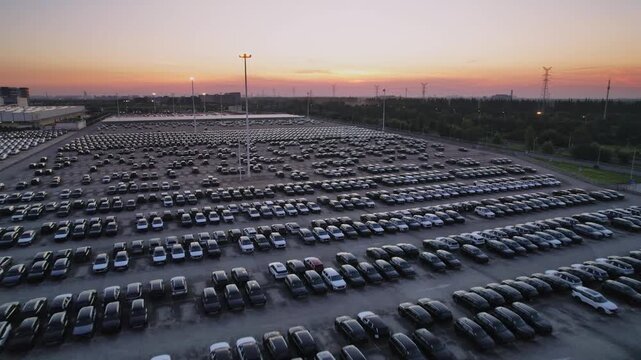The newly produced cars from the automobile factory are parked in the parking lot