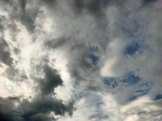 A stunning shot of a sky filled with dramatic, swirling grey and white clouds