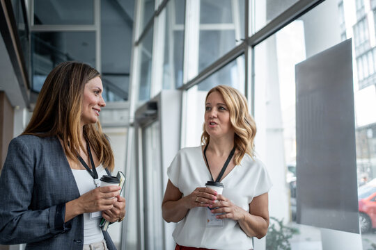 Businesswomen talking during coffee break at conference