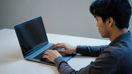 Man working remotely on laptop computer