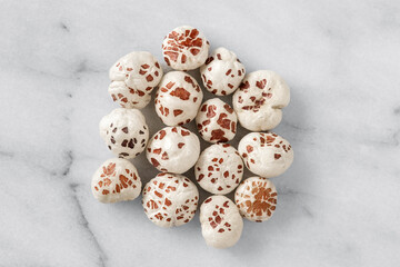 Close-up of a puffed lotus seed, makhana, an exotic vegetable ingredient