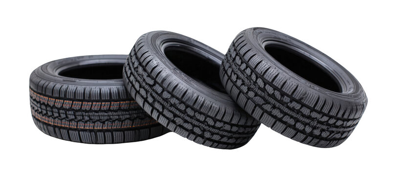 Three different types of car tires stacked on each other, showcasing tread patterns for automotive use