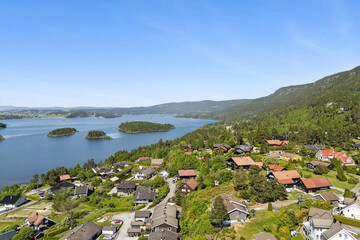 beautiful areal view of typical norwegian village from above with luxury villas sea fishermen's...