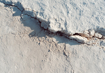 Fototapeta premium Aerial view of vast white salt flat landscape