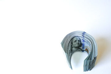 US hundred dollar bills on white background with space for text, symbolizing money, wealth, finance, investment, real estate and banking.
