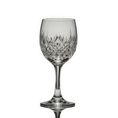Photo of an elegant crystal wine glass with intricate diamond cut patterns, isolated on a transparent background