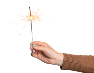 Bright sparks fly from a sparkler held in a hand, capturing a moment of celebration.