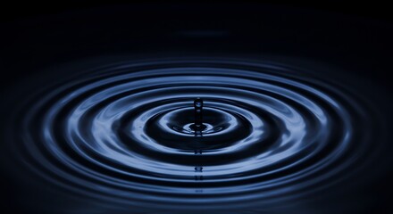 Water Droplet Creating Ripples on Dark Surface