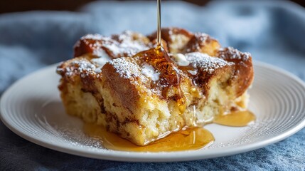 Close up shot of delicious French toast being drizzled with maple syrup