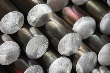 Stack of steel rods in a factory, a product of the metallurgical industry, macro view