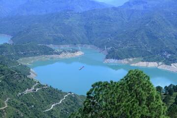 Tehri Lake, nestled in the Garhwal Himalayas of Uttarakhand, is a stunning man-made reservoir...