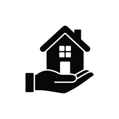 Hand holding a house icon symbolizing home ownership and real estate