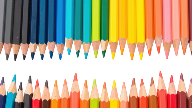 Colorful pencils arranged in vibrant spectrum, showcasing variety of shades from blue to yellow and red to orange, perfect for artistic expression