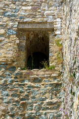 old stone wall with window as abstract background