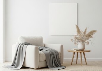 Cozy living room with a plush armchair draped in a grey blanket and a side table with decor