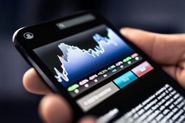 ETF or crypto index in mobile. Broker with phone. Exchange traded fund. Wealth and stock market...
