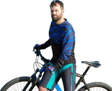Cyclist in shorts and jersey on a modern carbon hardtail bike with an air suspension fork standing on a cliff against the background of fresh green spring forest - Powered by Adobe