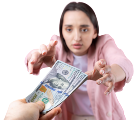 A woman in a pink jacket receives a bribe in dollars against a red background.