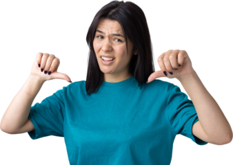 Young brunette in a blue tank top giving thumb down gesture looking with negative expression