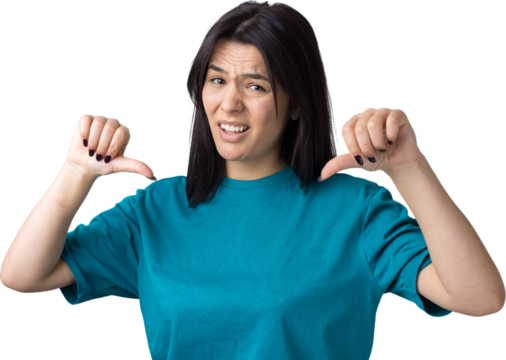 Young brunette in a blue tank top giving thumb down gesture looking with negative expression