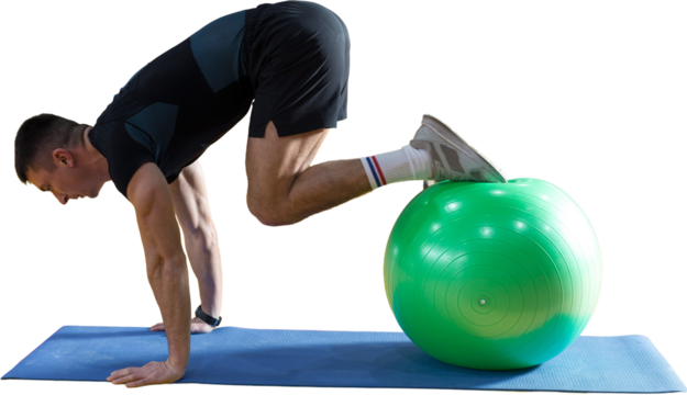 Athletic guy in sportswear and fitness tracker doing exercises in gym.