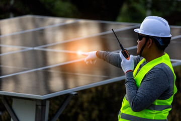 Energy Technician with Radio at Installation Site.the supervision and operational aspects of solar...