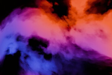 An abstract image depicting swirling, nebulous clouds of vibrant blue, pink, and orange hues...