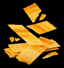 Falling long chips isolated on black background, rectangular potato snacks, package design element