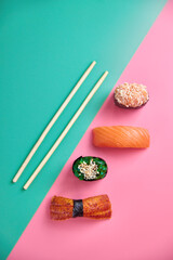 A vibrant assortment of fresh sushi, including nigiri, rolls, and sashimi, beautifully arranged on a dark slate. The vibrant colors and textures highlight the variety and freshness of the seafood.