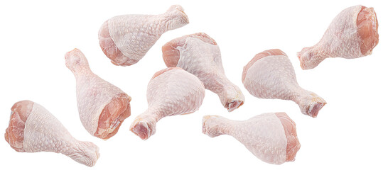 Falling raw chicken drumsticks isolated on white background with clipping path