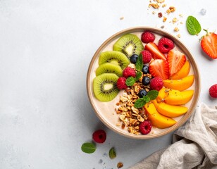 Smoothie bowl with granola and fruit, overhead shot
