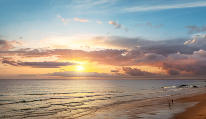 Beautiful sunset in the ocean. Sun reflected on the water surface with a beautiful glitter path.