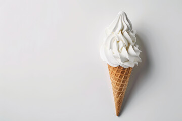 Vanilla ice cream in a waffle cone, isolated on a white background, showcasing a classic dessert treat.