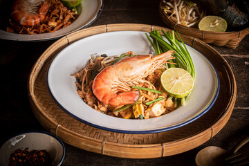 Pad Thai with thin noodles, dry, and tamarind sauce mixed with eggs and minced tofu. Thai food.
