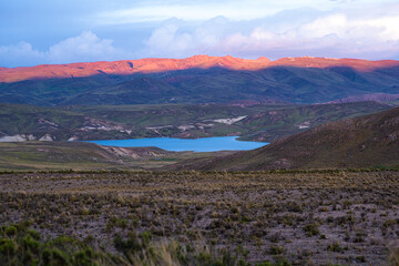 Sunset over mountains and lake in Peru